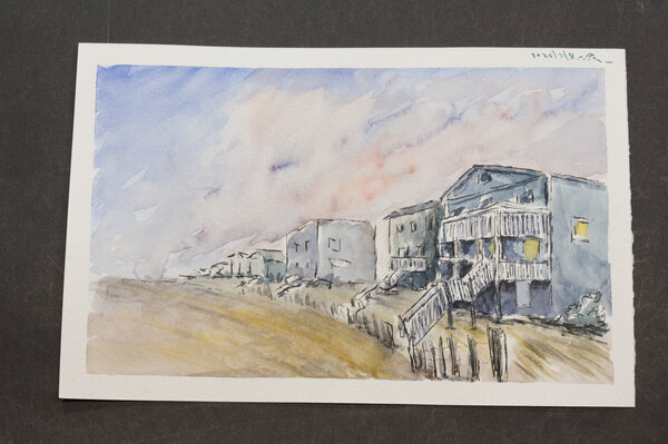 Ink and wash of a row of boxy beach houses along the coastline.