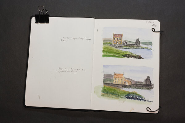 Two watercolor attempts at a Shetland countryside manor on a shoreline with a servants house extended off the main building. This is a second round, still not good.