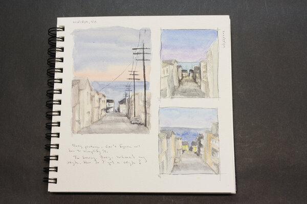 Three watercolor attempts at a scene looking down the street toward the ocean with houses on both sides and at the far end.