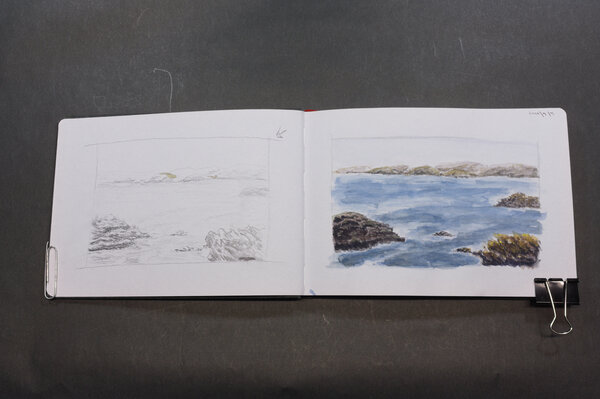 First attempt at a watercolor of a gloomy Shetland seaside picture I found in a Shetland knits book. This version has most of the pieces from the photo: rocky shoreline in the front left and  right of the frame, and rolling hills in the background. Water is a deep blue gray, though I didn't capture the dreary as well as I hoped.